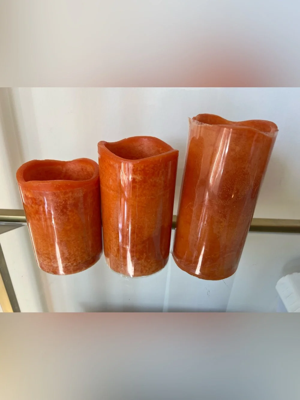 Set of 3 orange pillar LED wax candles